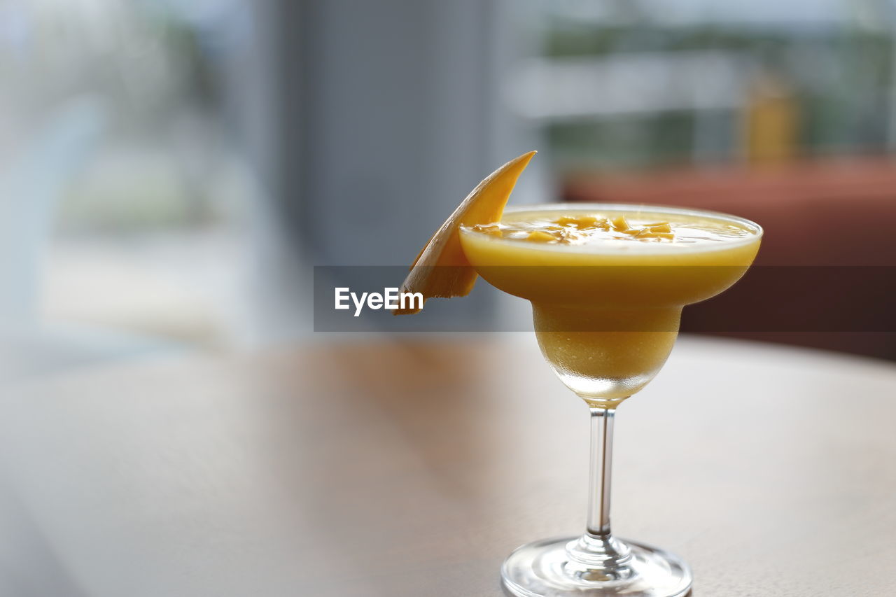 Close-up of drink on glass on table