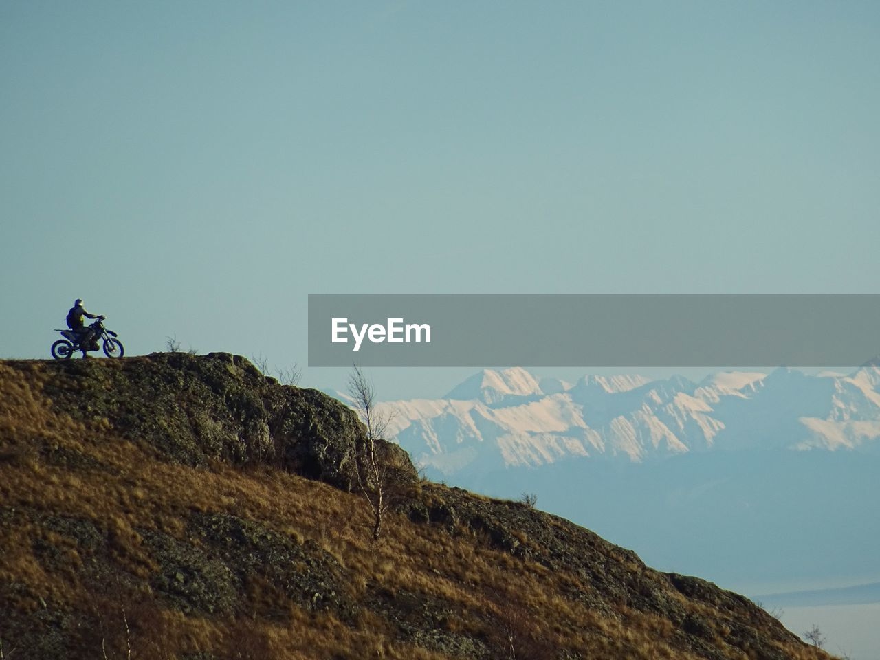 SCENIC VIEW OF MOUNTAINS AND CLEAR SKY