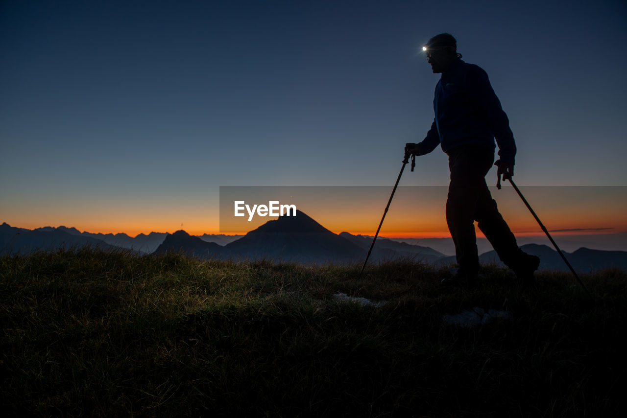 Hiker with flashlight on his forehead