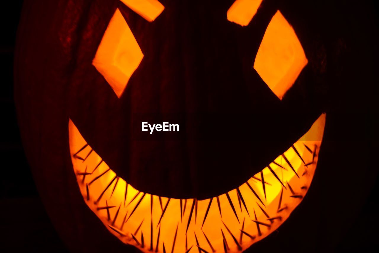 Close-up of illuminated jack o lantern during halloween