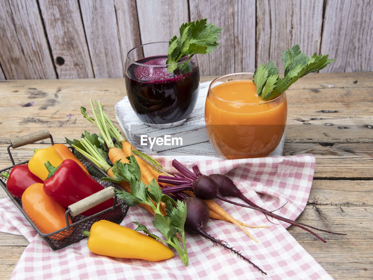 CLOSE-UP OF FRUITS AND VEGETABLES ON TABLE AGAINST WALL