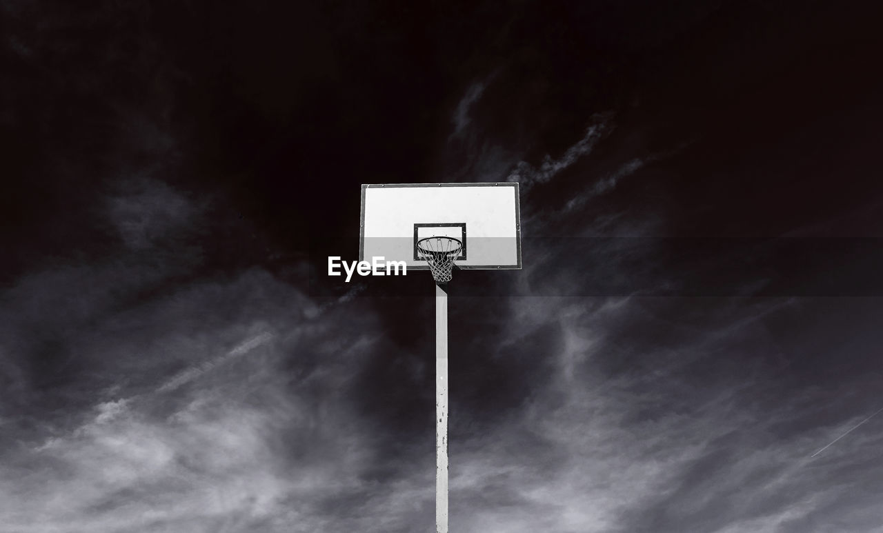 Basket backboard on a dark cloudy sky