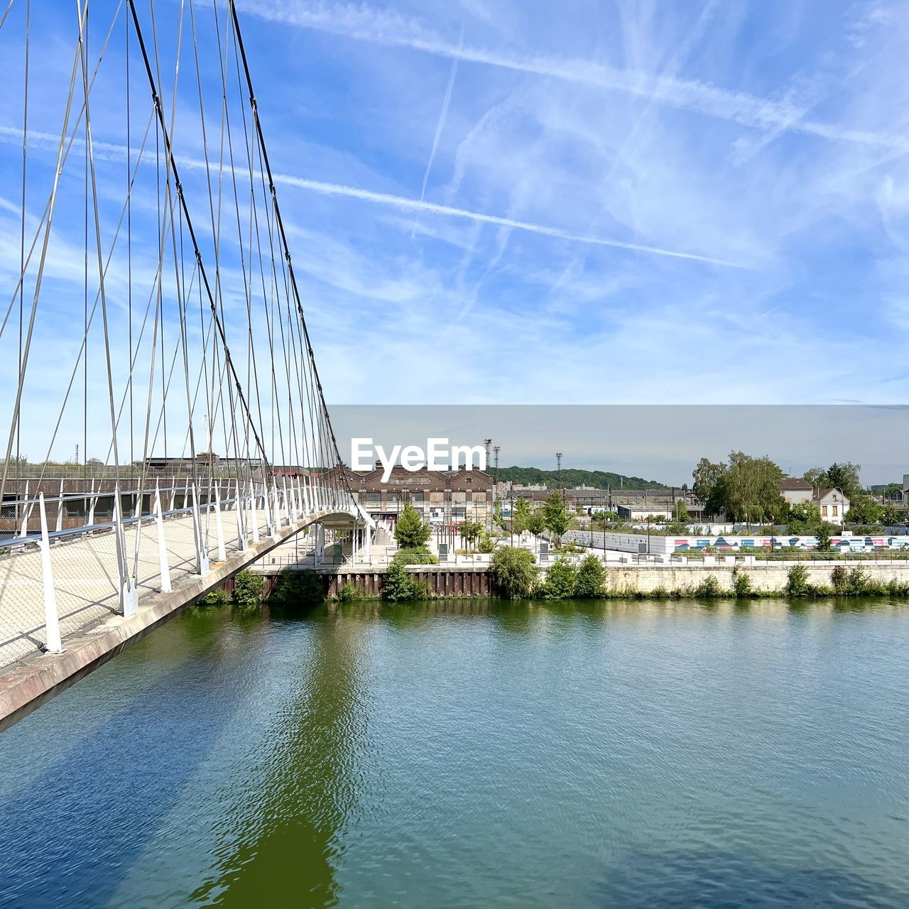 Bridge over river against sky