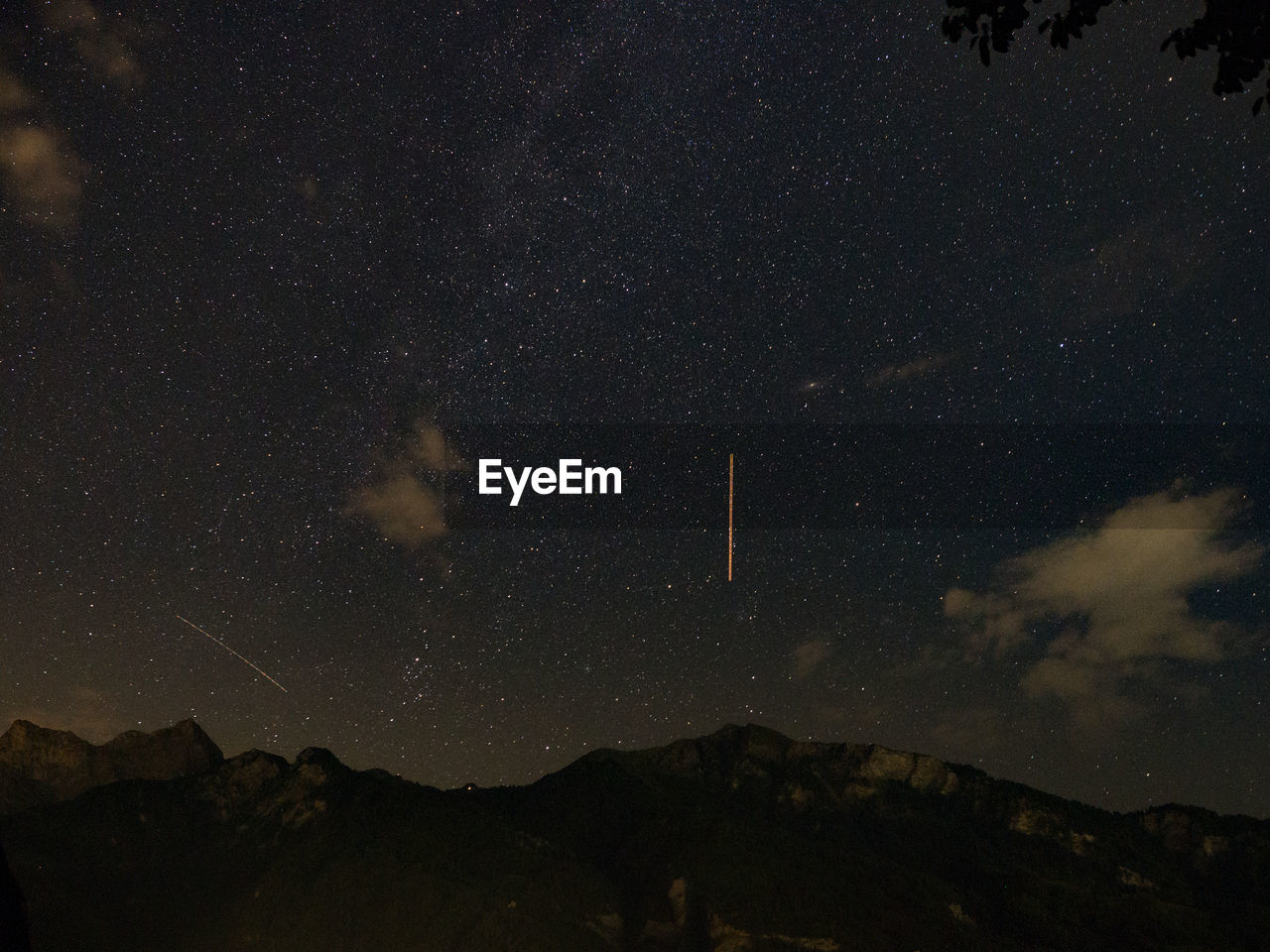 Low angle view of mountain against sky at night