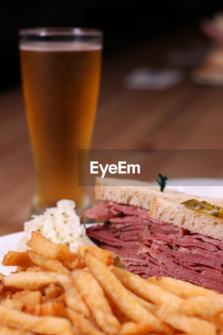 Close-up of food and beer on table