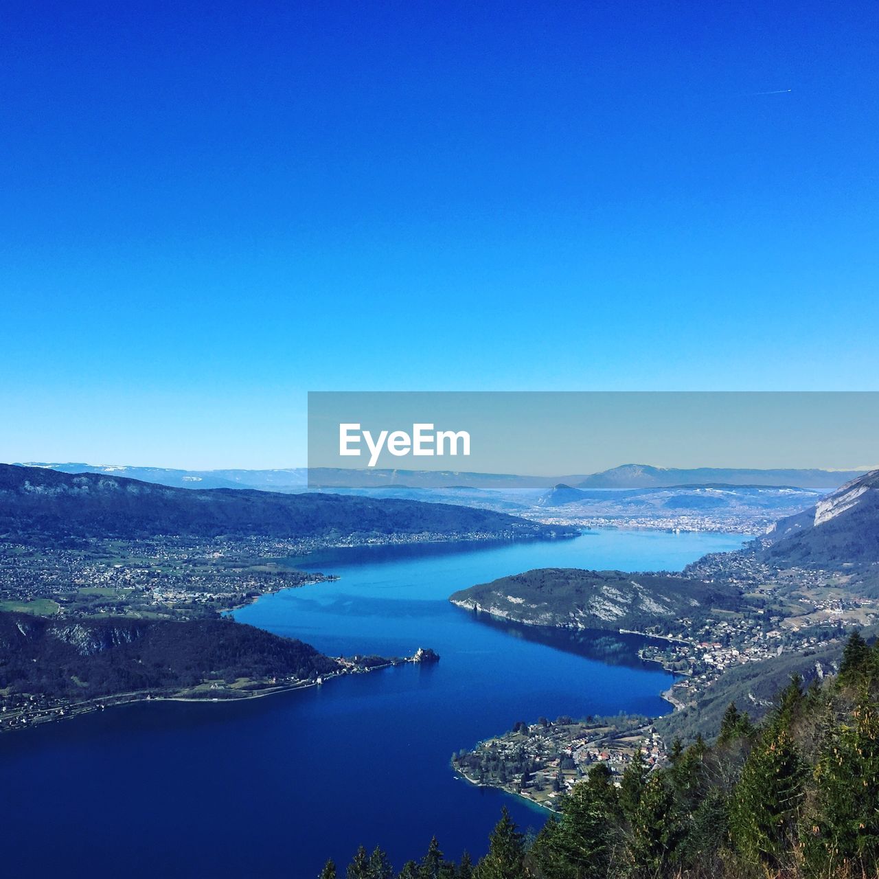 High angle view of sea against clear blue sky