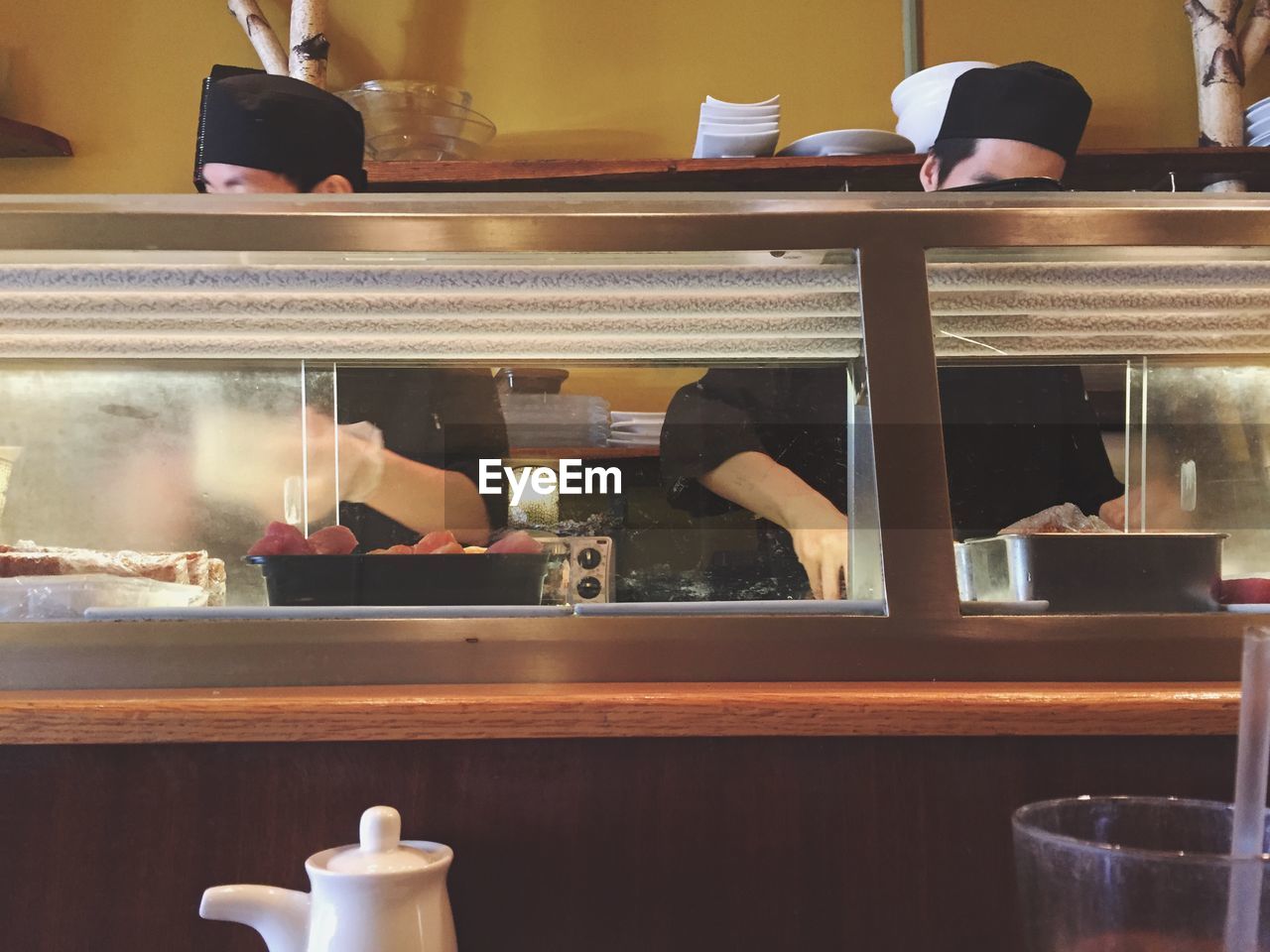 Chefs working in kitchen at restaurant