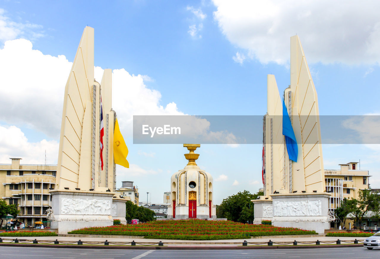 Thailand democracy monument building against cloudy sky