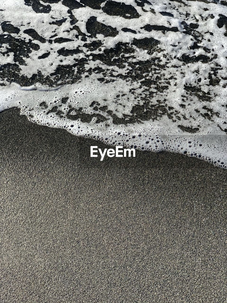 FULL FRAME SHOT OF WET SAND
