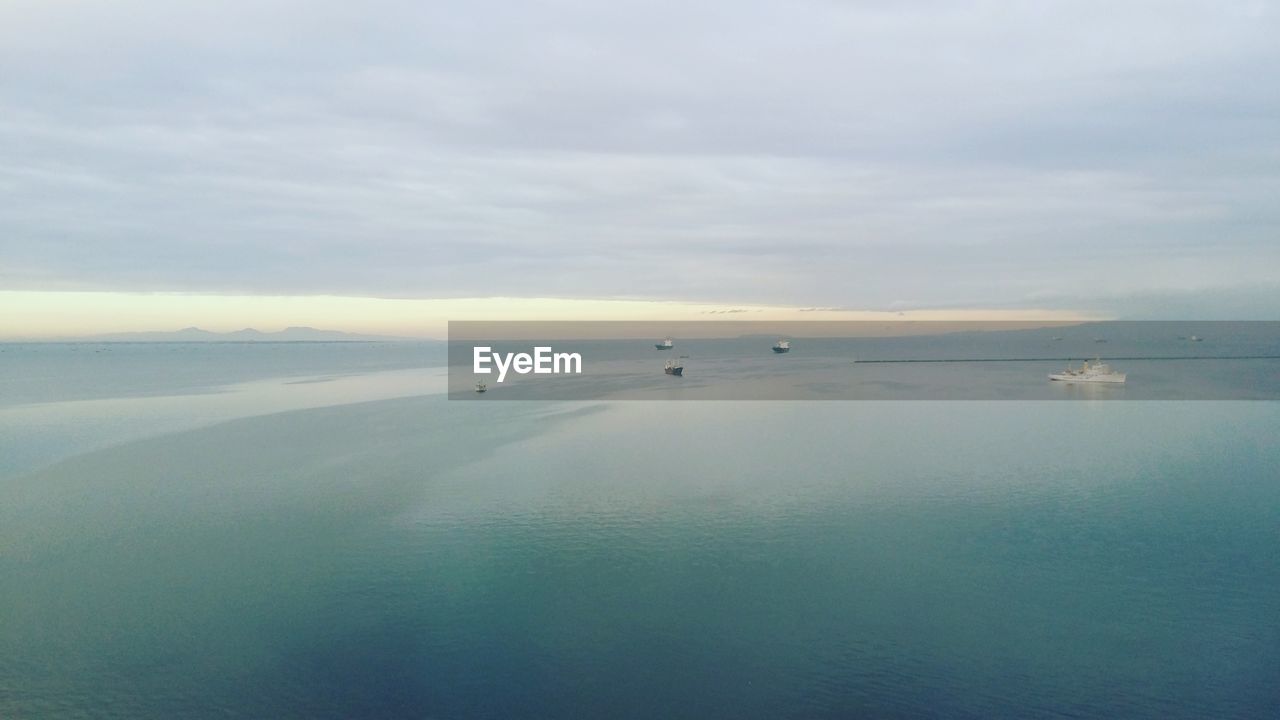 Scenic view of seascape against cloudy sky