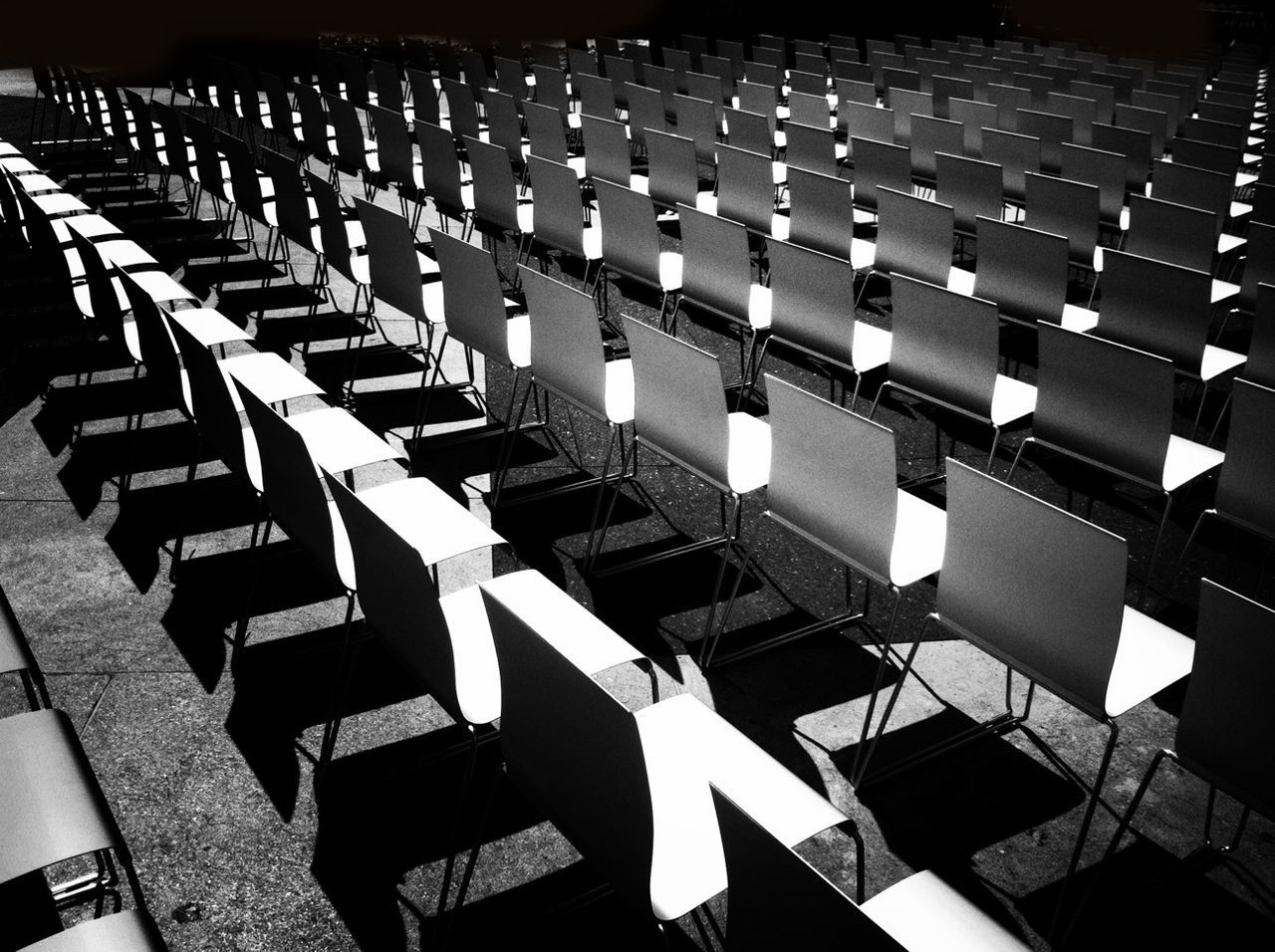 View of empty chairs in rows