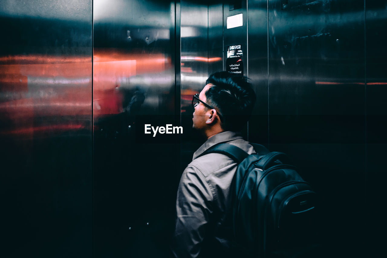 MAN PHOTOGRAPHING THROUGH CAMERA