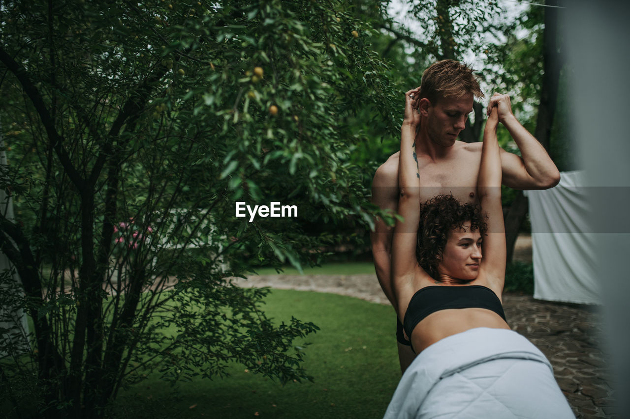 Portrait of woman holding plant