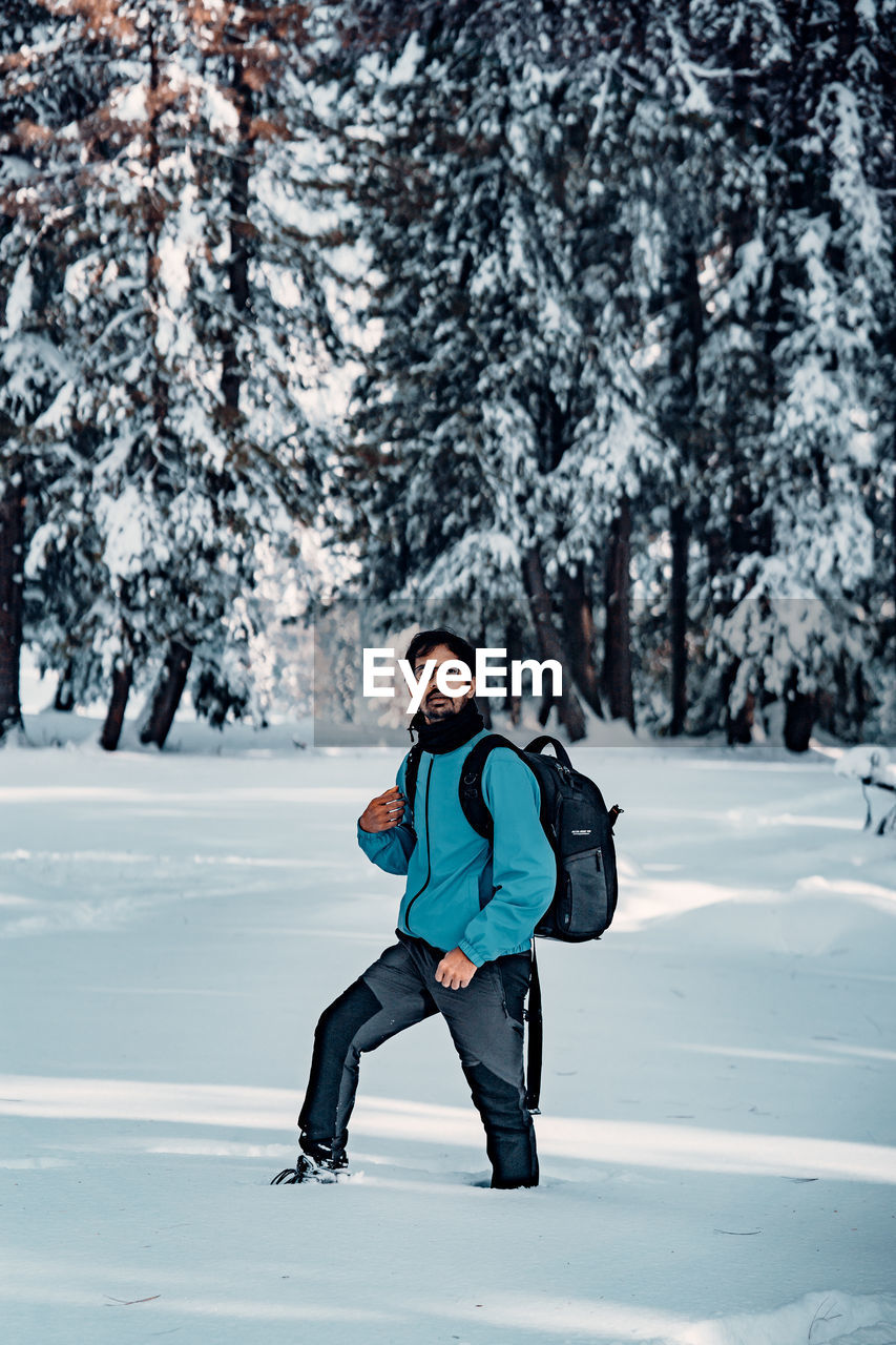 Full length of boy standing on snow