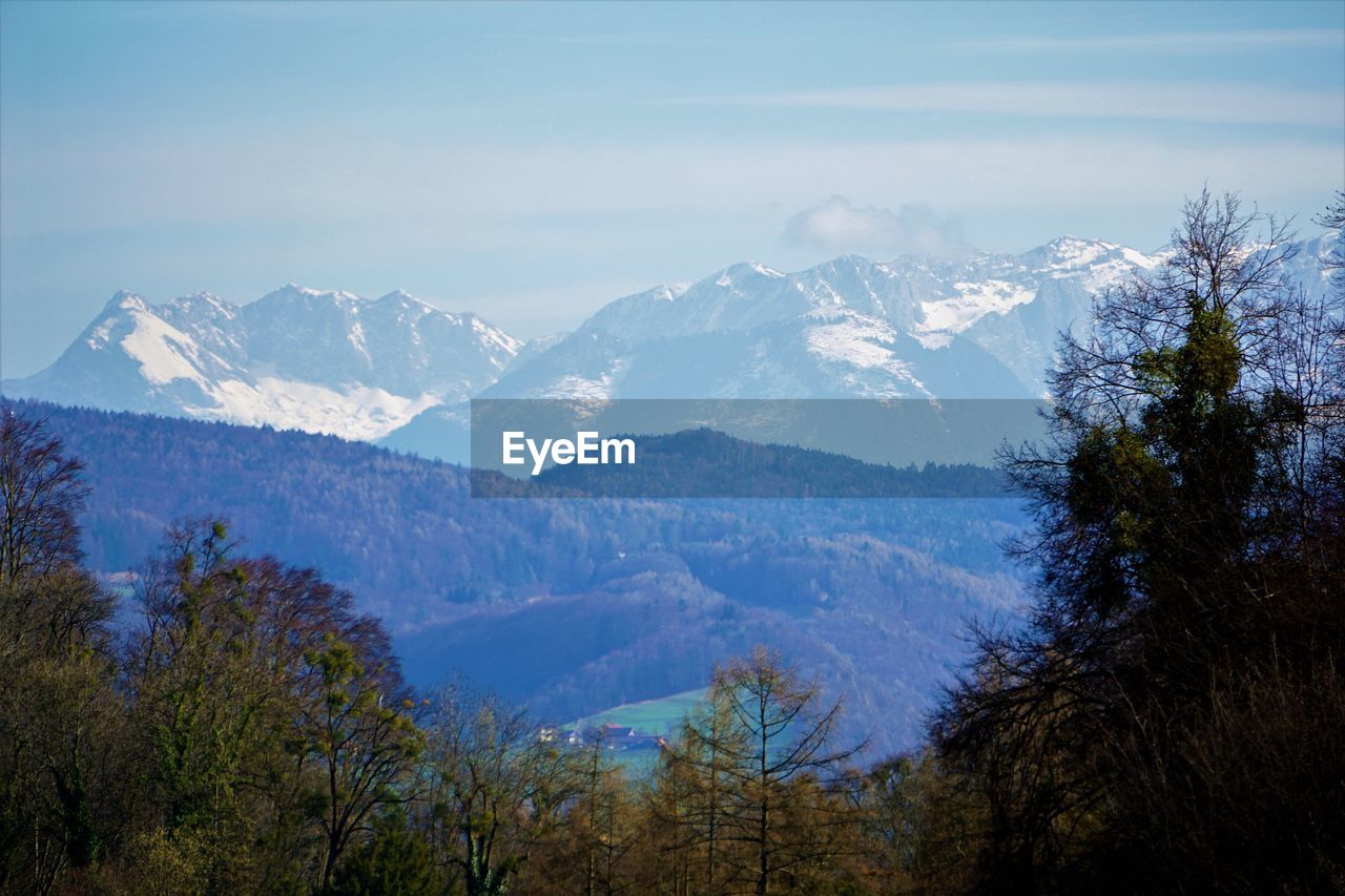 Scenic view of snowcapped mountains against sky