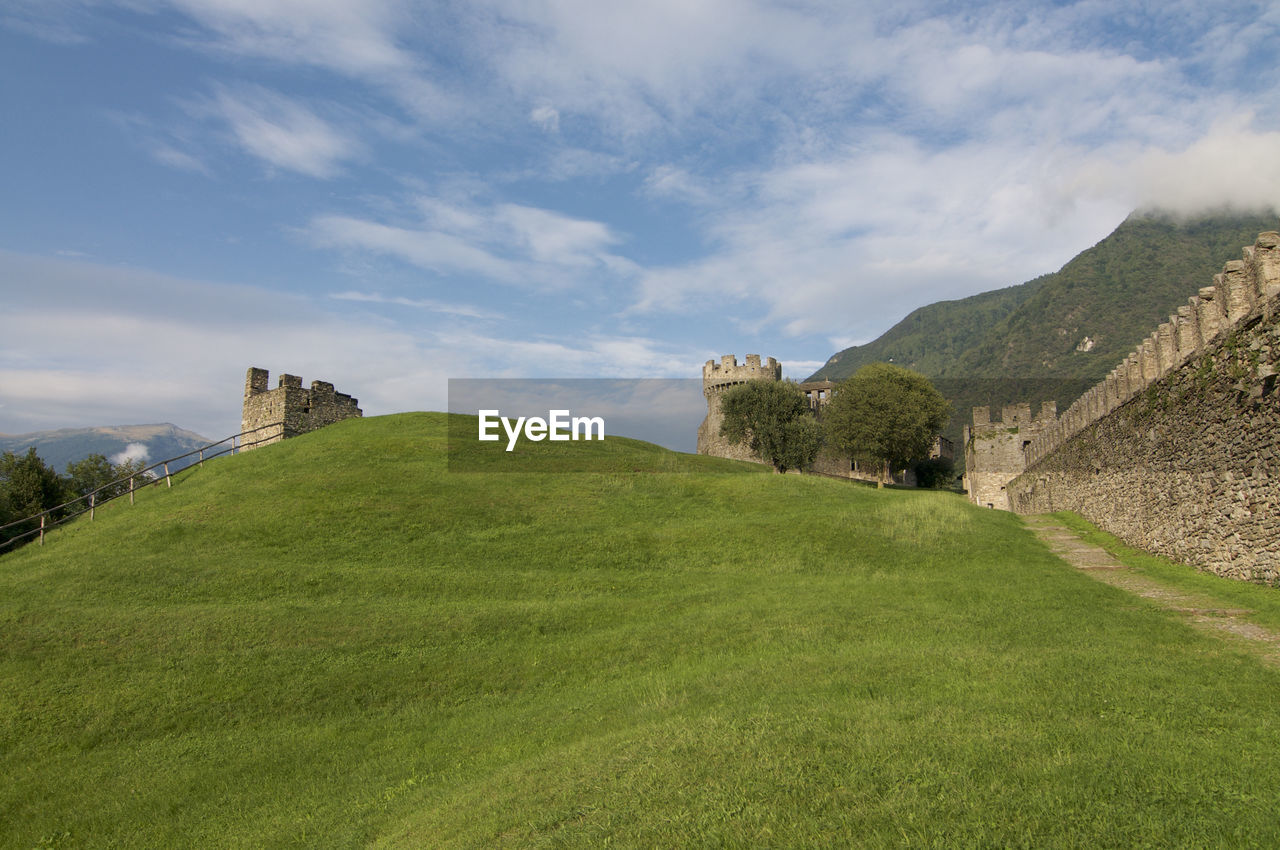 View of the medieval castle walls of the world unesco heritage site in bellinzona, switzerland