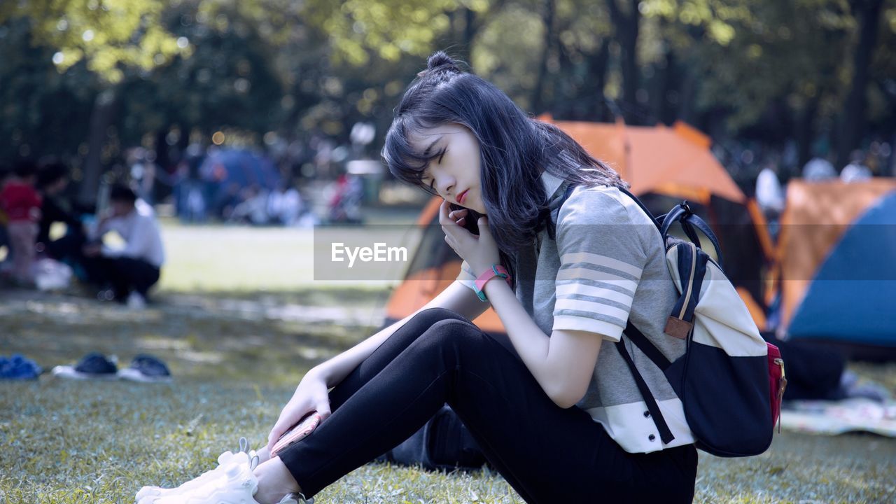 Woman sitting on grass