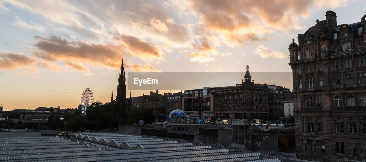 VIEW OF CITYSCAPE AT SUNSET