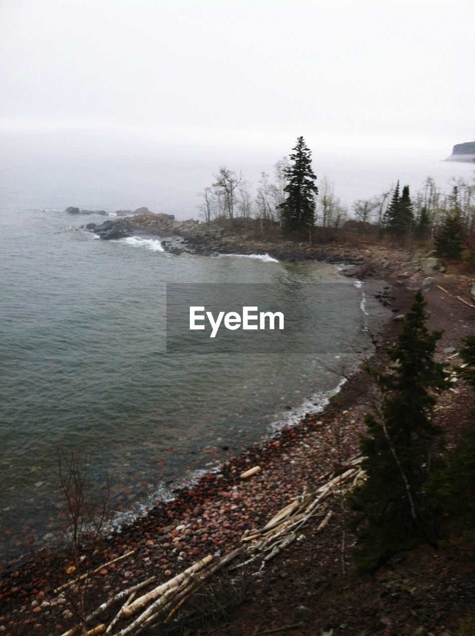 High angle view of lake against sky during foggy weather