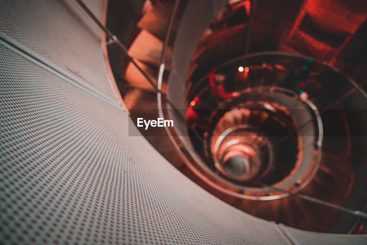 HIGH ANGLE VIEW OF SPIRAL STAIRCASE OF RAILING