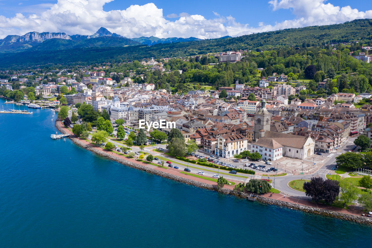 HIGH ANGLE VIEW OF TOWNSCAPE AND SEA BY TOWN