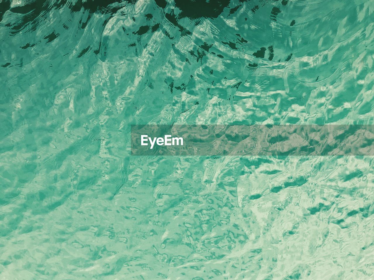 HIGH ANGLE VIEW OF FROZEN SEA