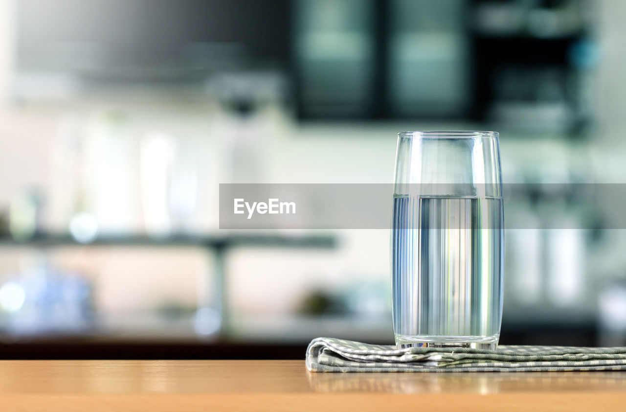 CLOSE-UP OF DRINK ON TABLE