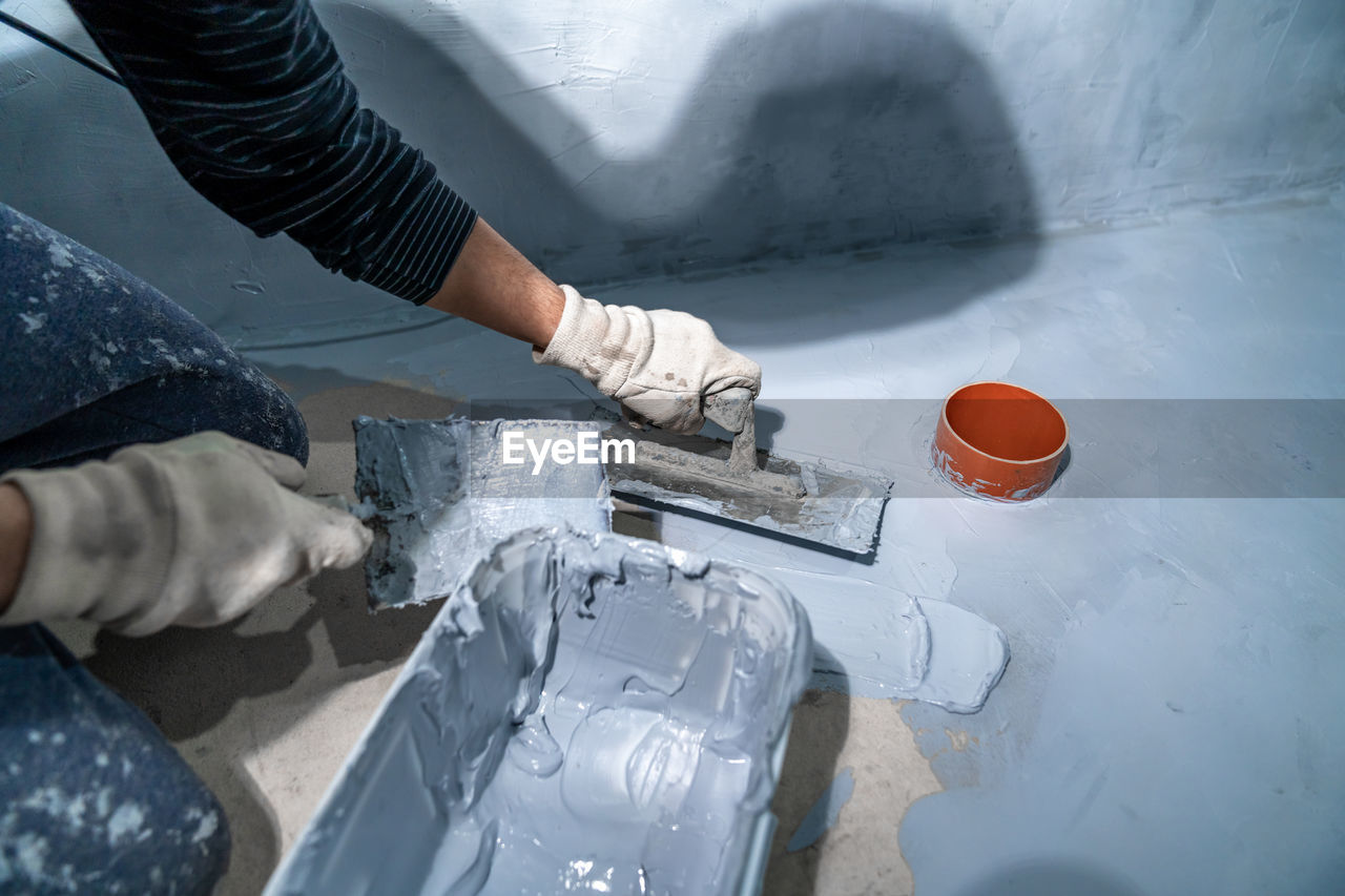 cropped hands of man working on table