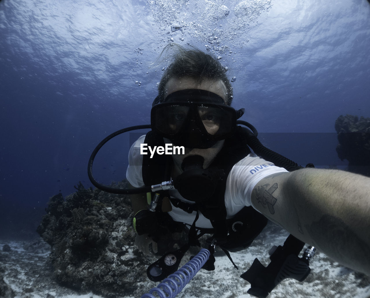 man scuba mask in sea