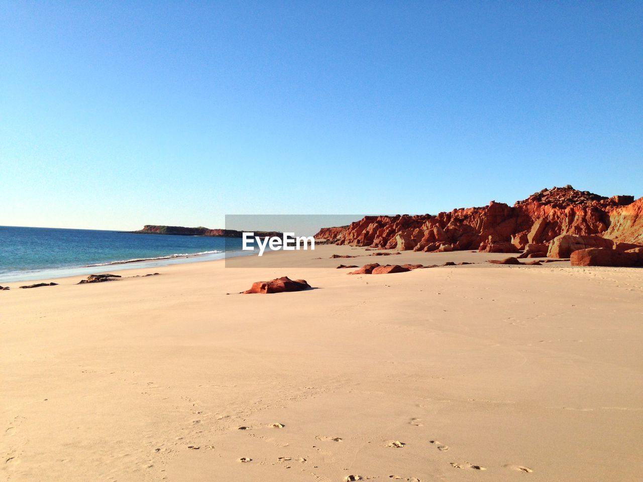 SCENIC VIEW OF BEACH AGAINST CLEAR SKY