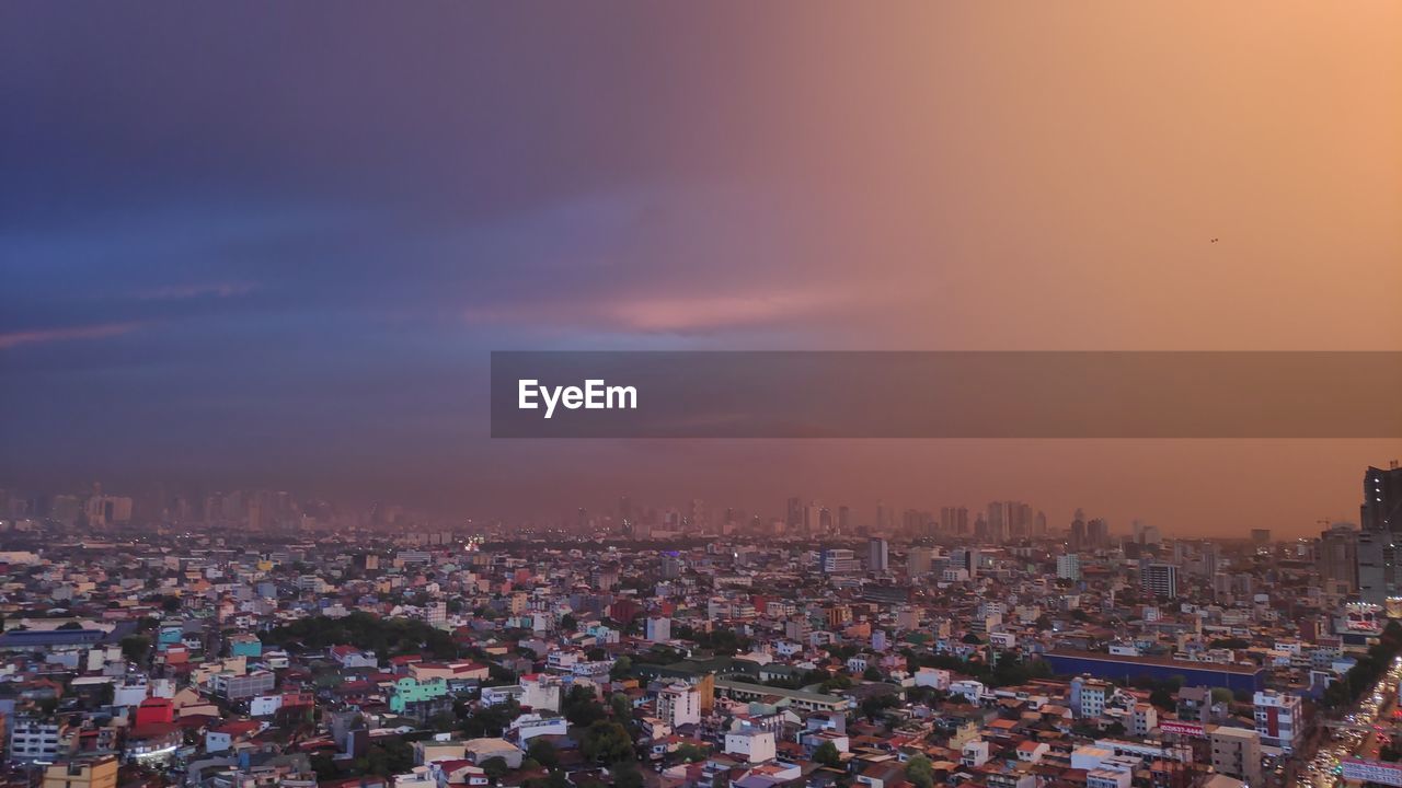 High angle view of townscape against sky during sunset