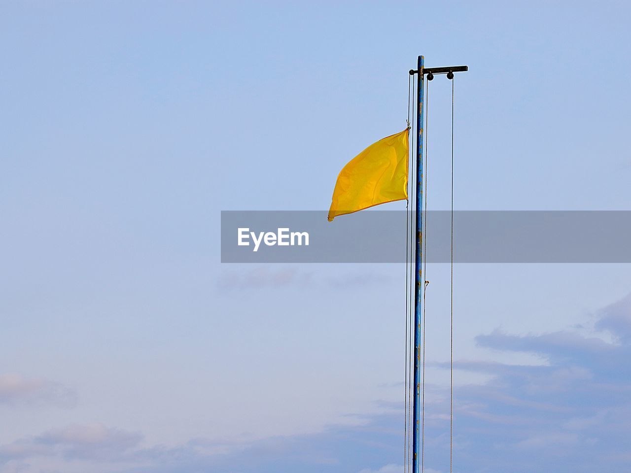 LOW ANGLE VIEW OF FLAGS