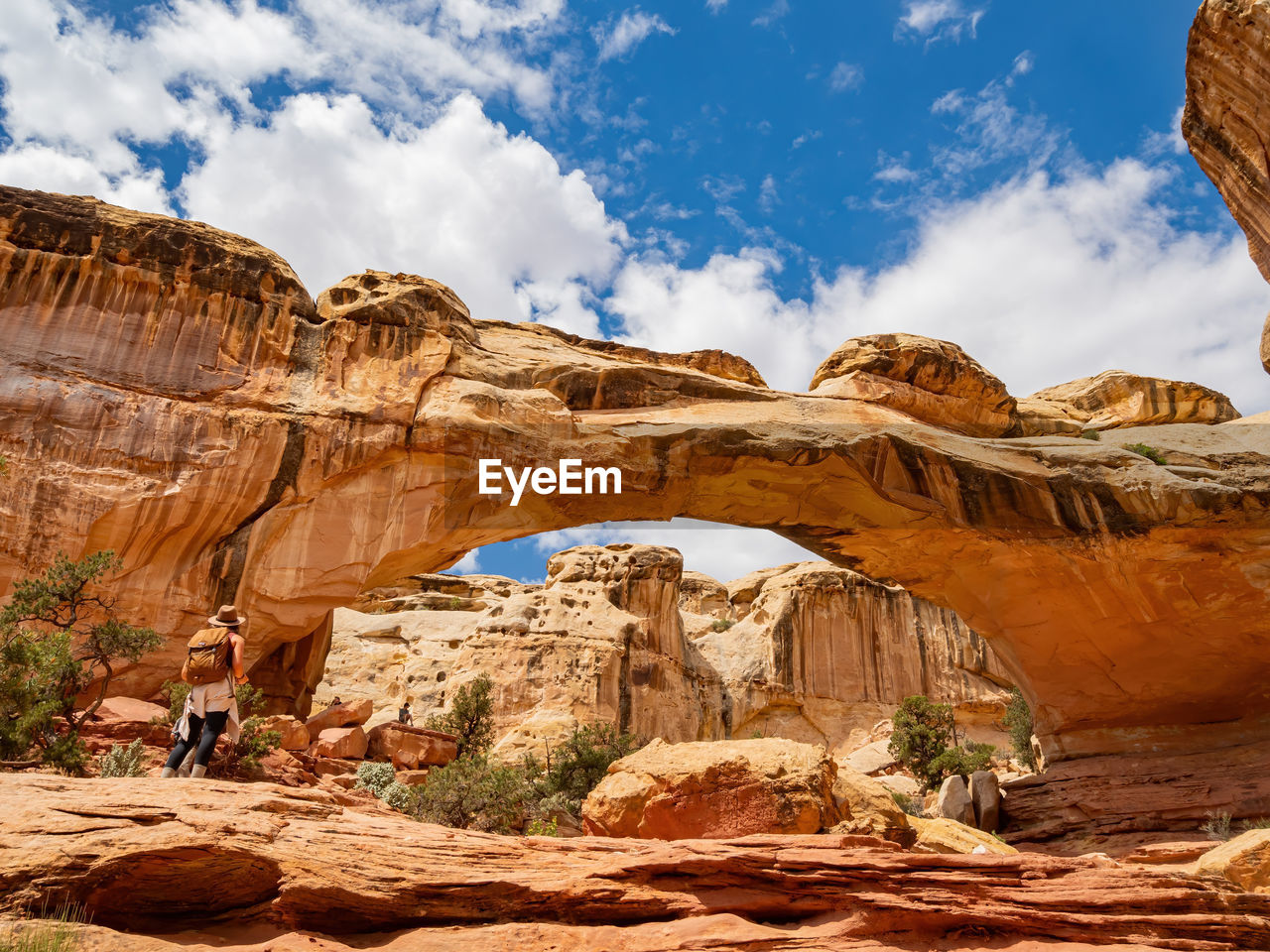 Low angle view of rock formation against cloudy sky