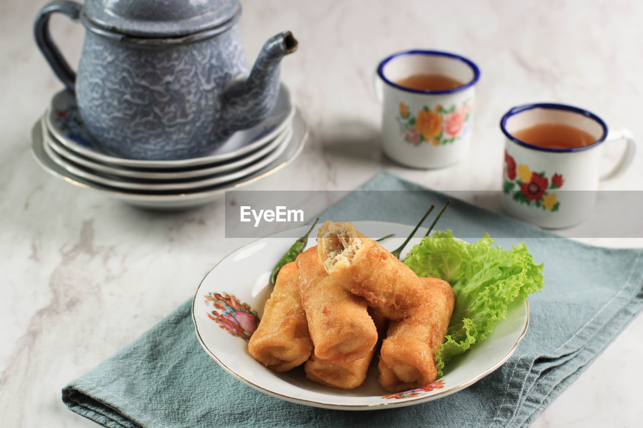 Sosis solo or fried egg crepe with minced beef or chicken filling. 