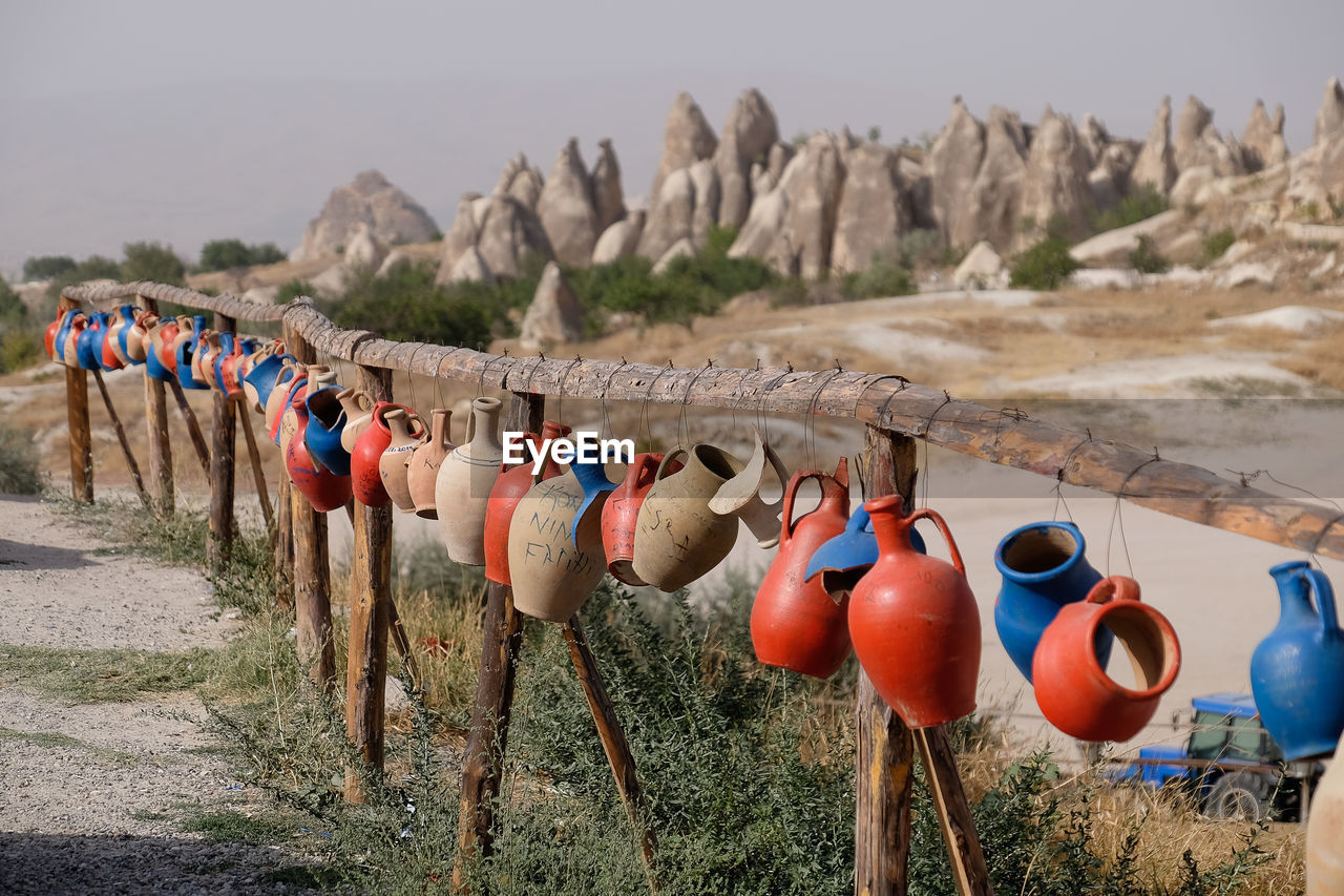 Coloured pots on fence in cappadocia