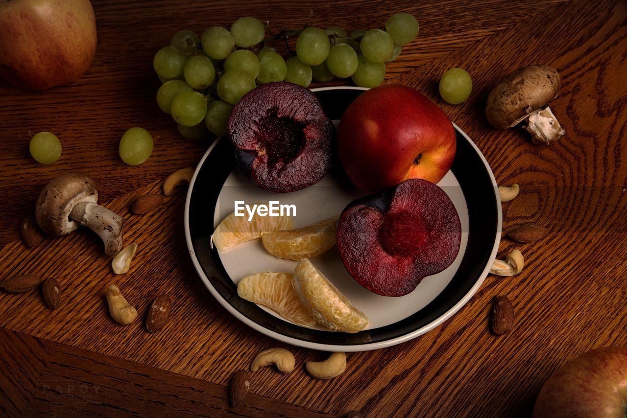 High angle view of fruits in plate on table