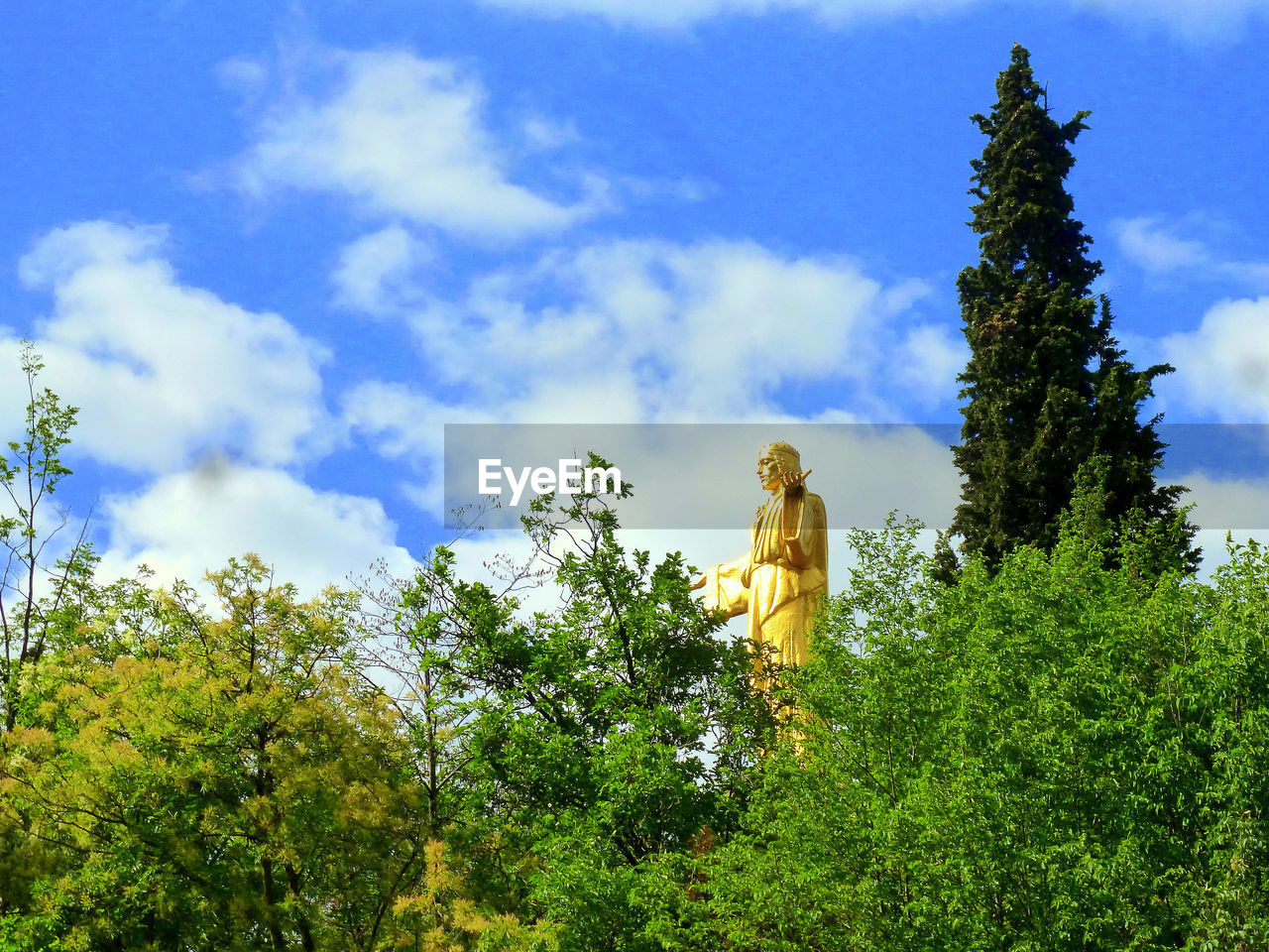 Low angle view of statue against sky