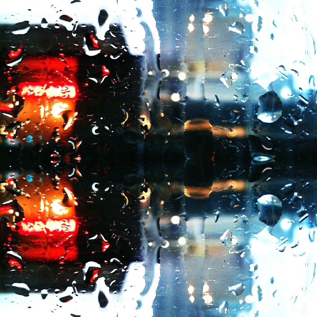 RAIN DROPS ON GLASS WINDOW