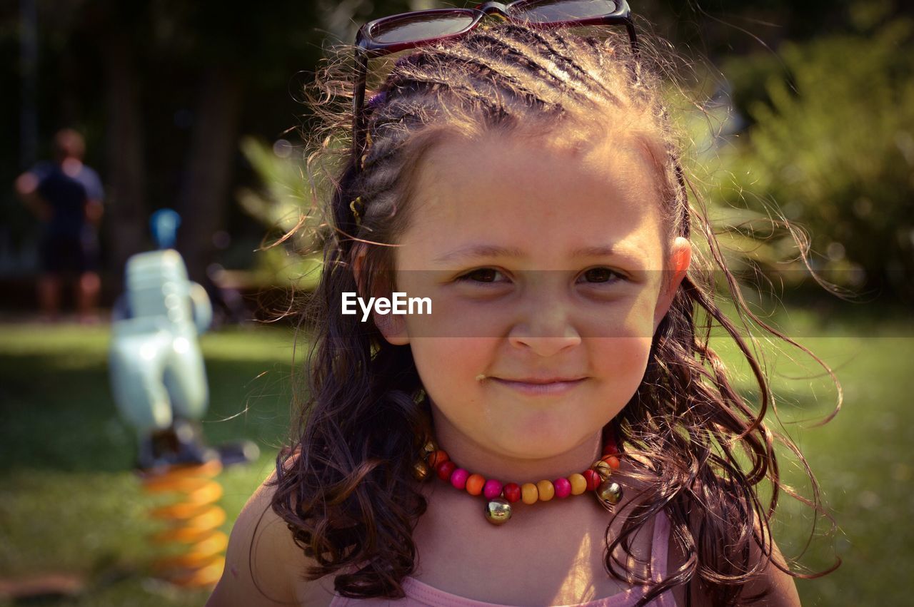 Portrait of girl standing at park