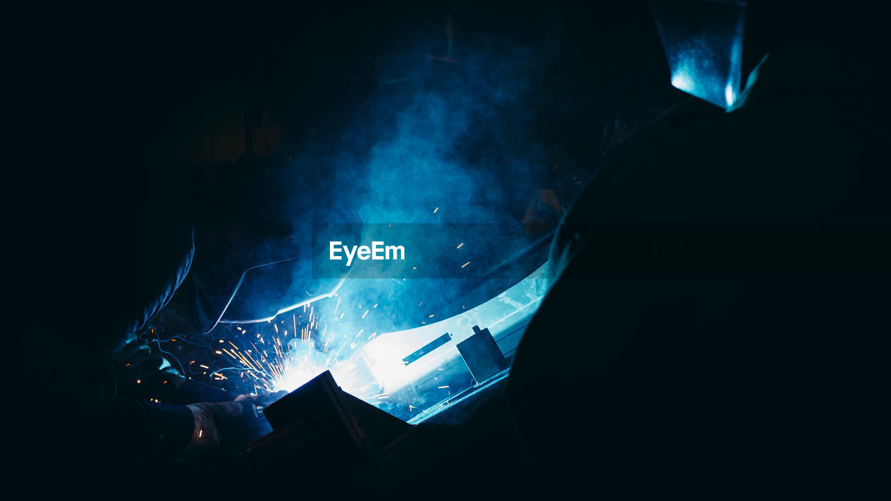 Welder working at night