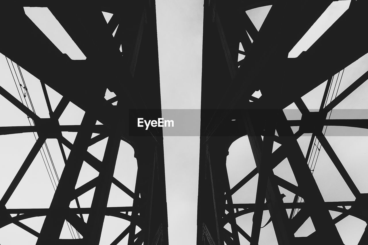 LOW ANGLE VIEW OF SUSPENSION BRIDGE AGAINST SKY