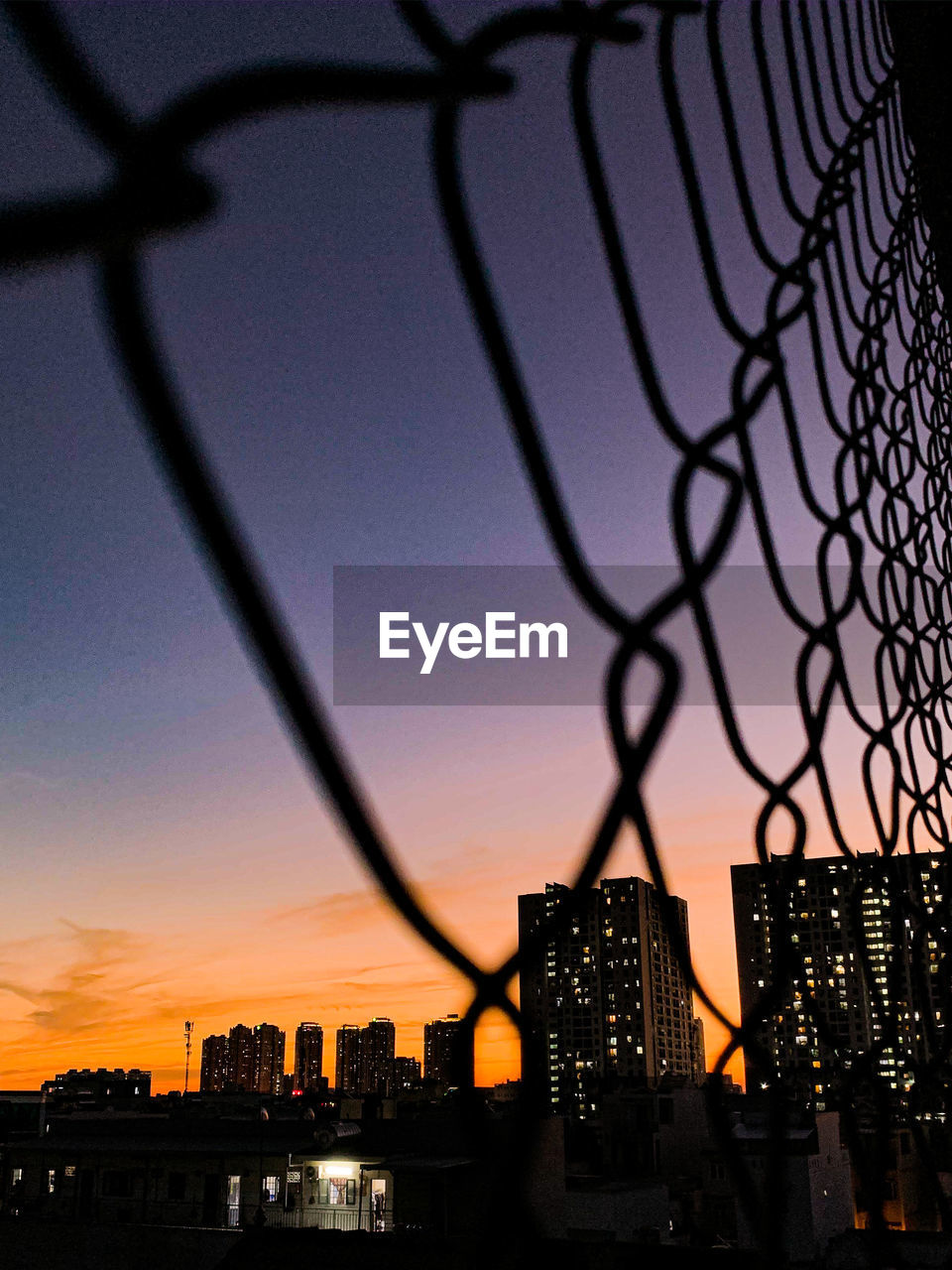 Silhouette of city buildings during sunset