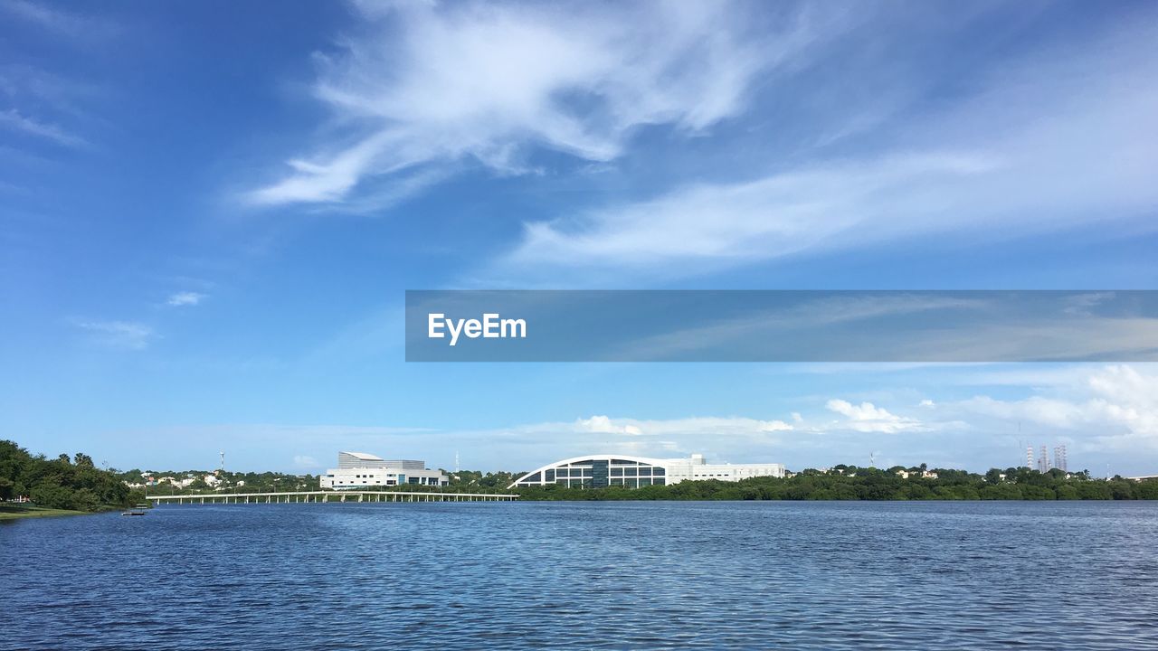 Scenic view of river against blue sky