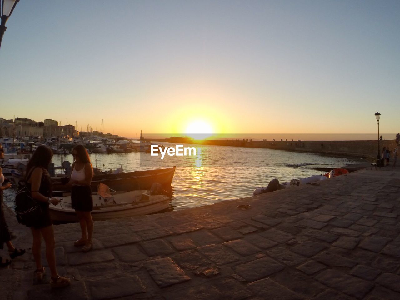 PEOPLE ON BEACH DURING SUNSET