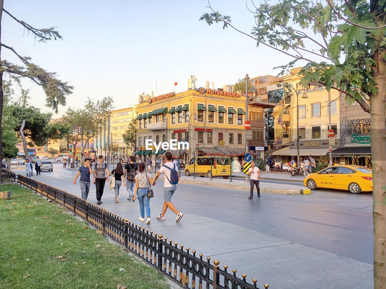 PEOPLE AT TOWN SQUARE AGAINST CLEAR SKY