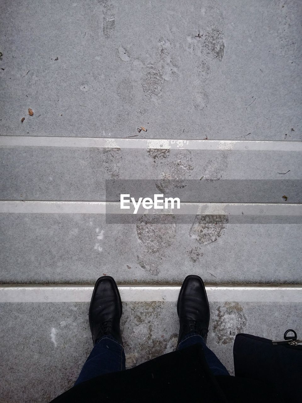 View of feet in the snow