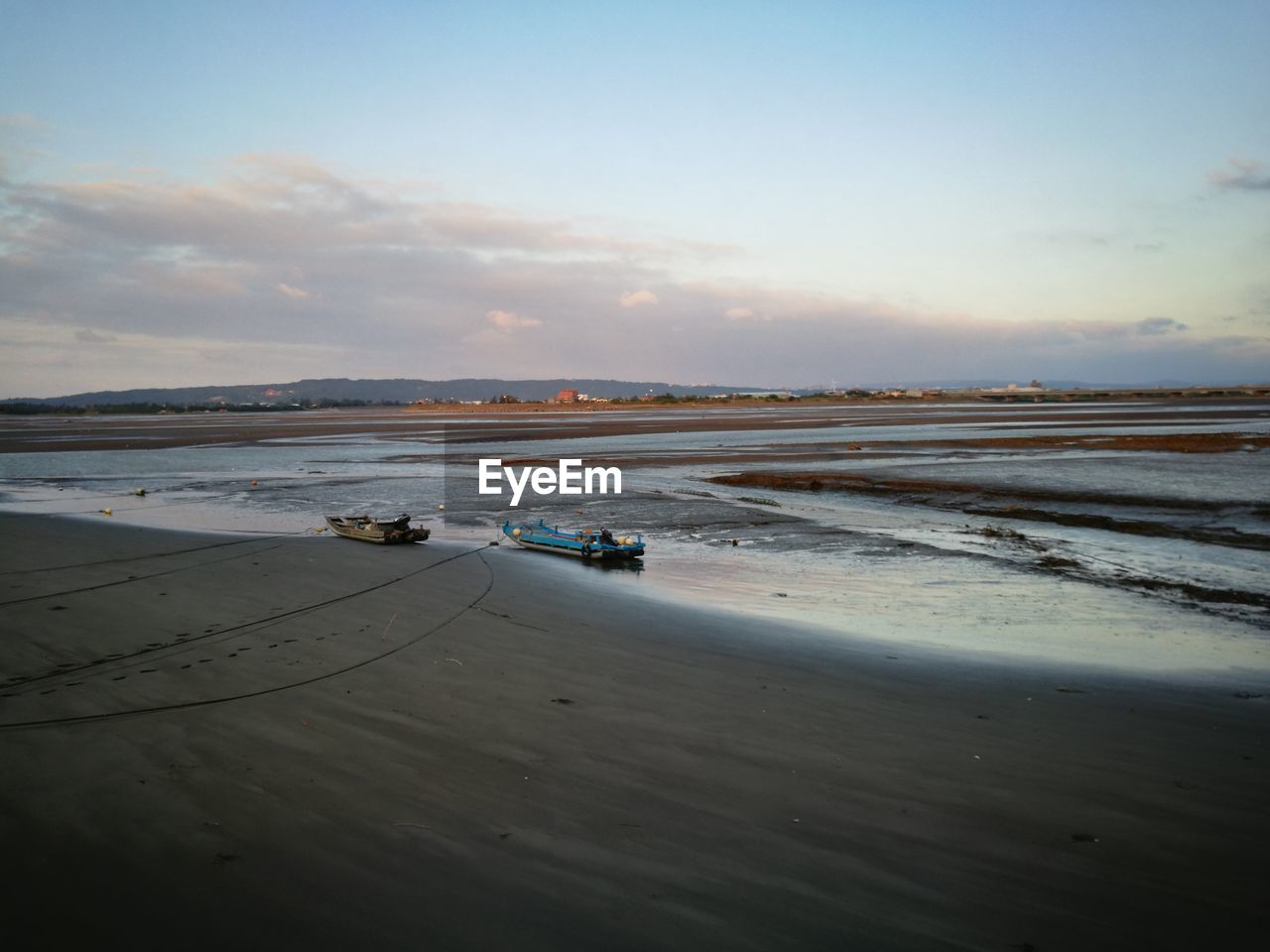 Scenic view of beach against sky during sunset