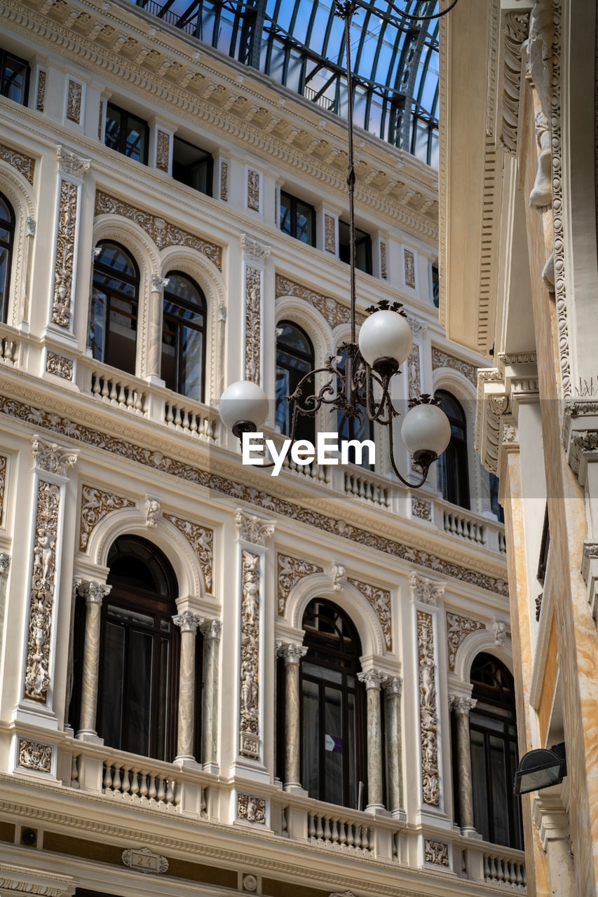 architecture, built structure, building exterior, landmark, facade, travel destinations, palace, no people, the past, history, low angle view, building, architectural column, arch, city, window, travel, tourism, classical architecture, day, ornate, architectural feature