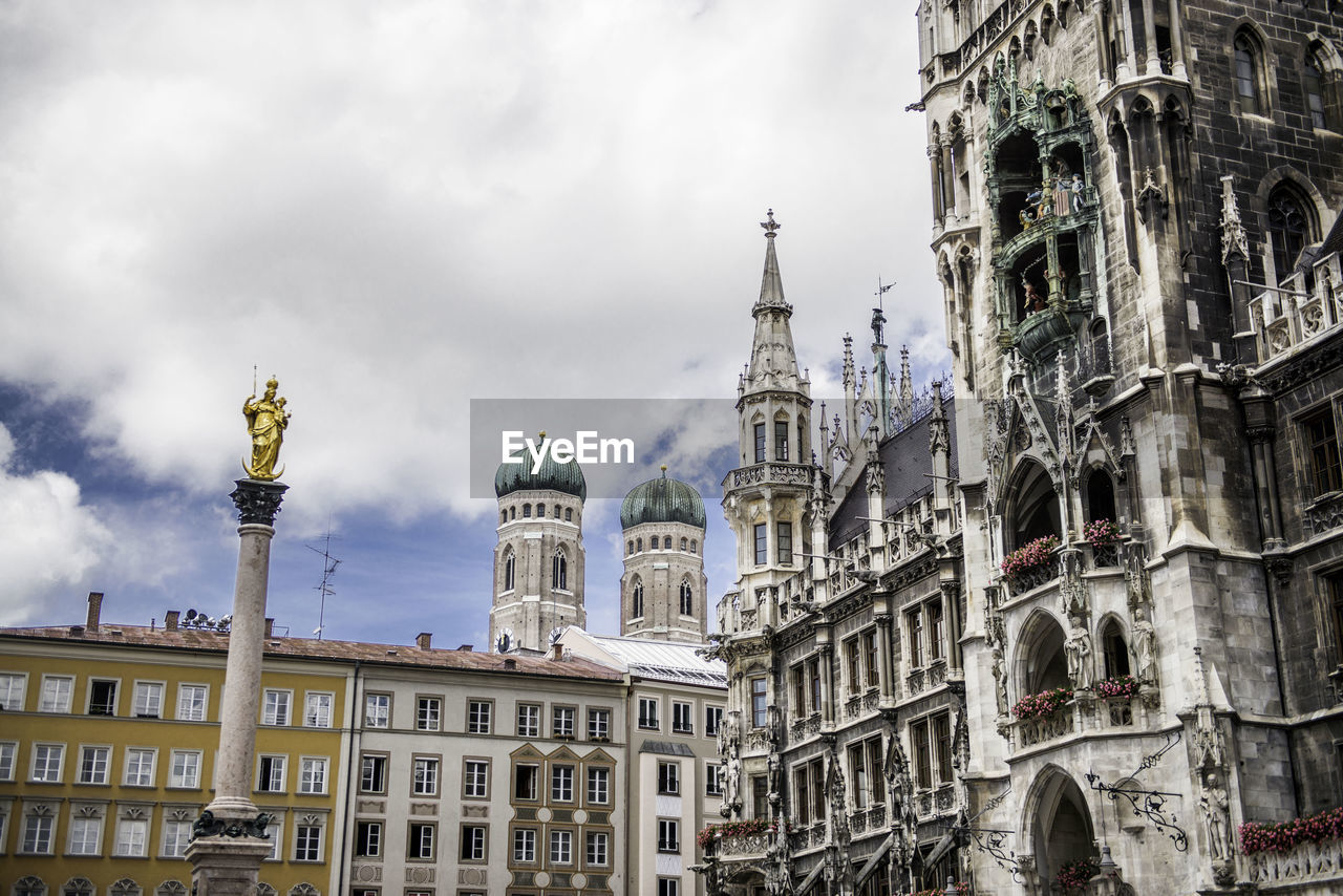 Low angle view of st marys column against sky at marienplatz