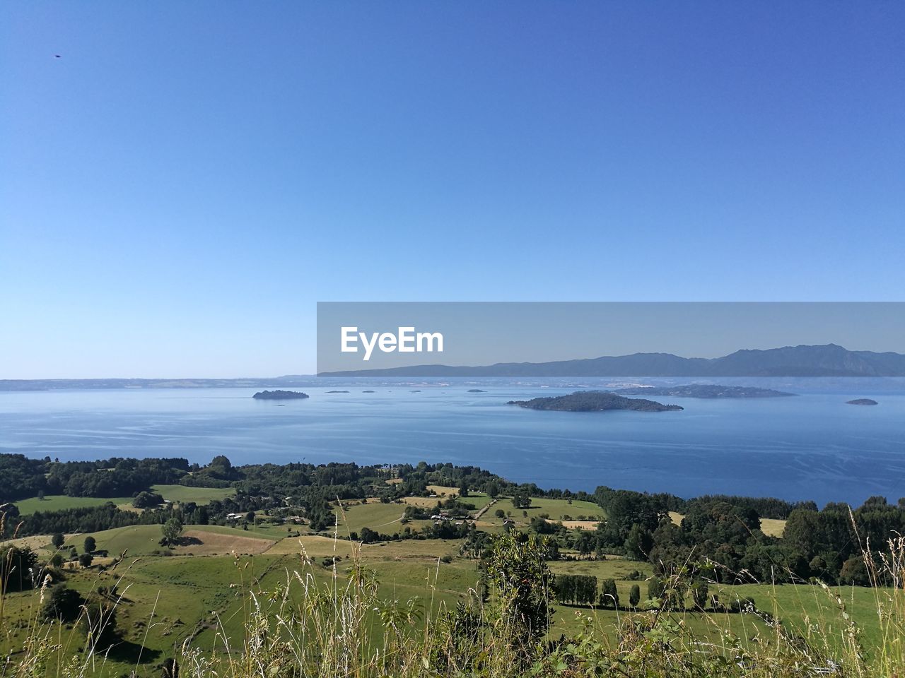 SCENIC VIEW OF BLUE SEA AGAINST CLEAR SKY